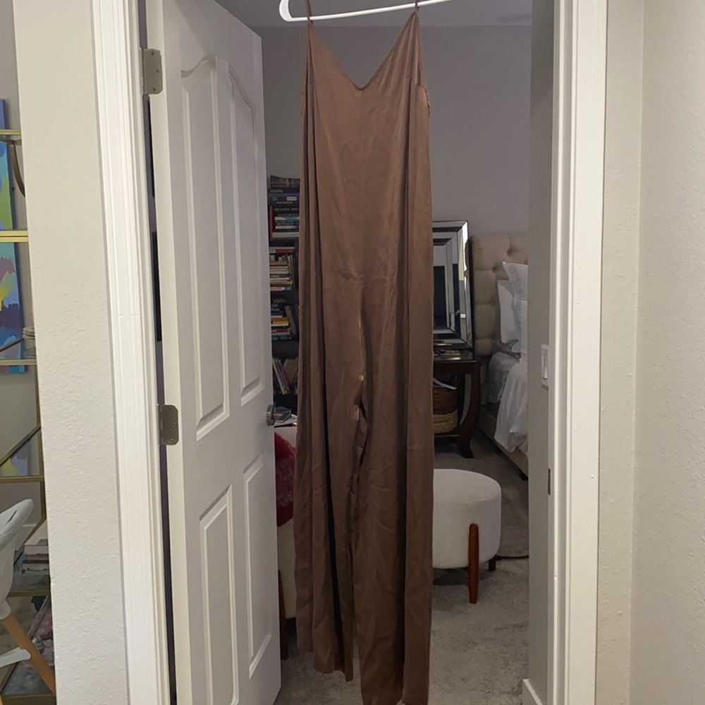 Calpulet size small brown jumpsuit. Lightweight silk material.